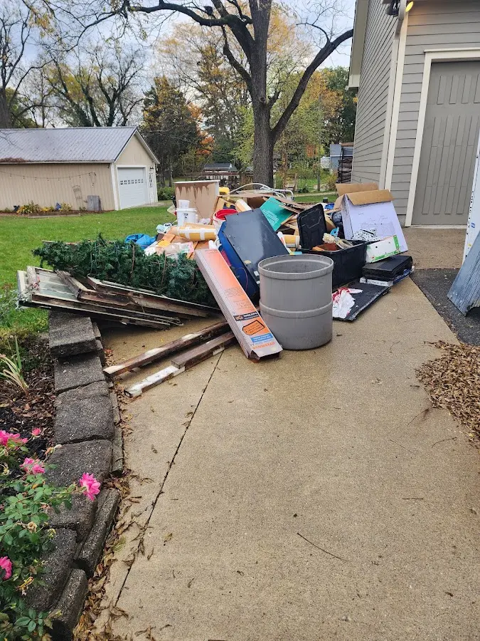 Dumpster being loaded with debris for 3 Yard Dumpster Rental in Hesston